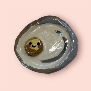 Cream and Brown Ceramic Art with Whimsical Designs